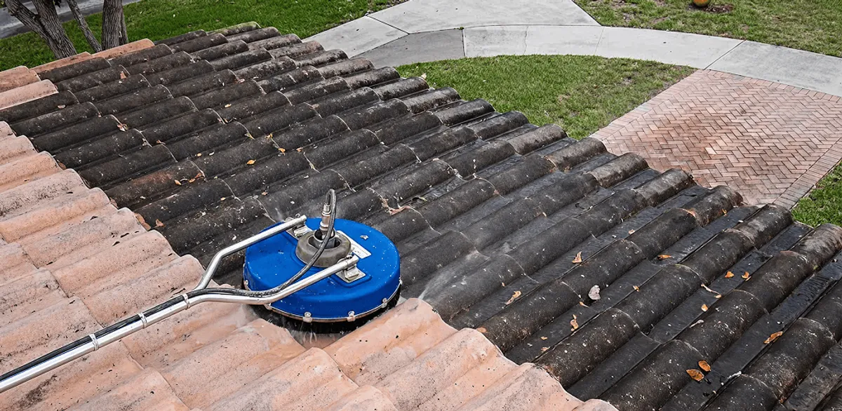 Roof pressure cleaning removing debris and buildup from roof tiles in Baton Rouge, LA